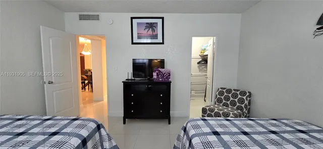 a living room with furniture a lamp and a window