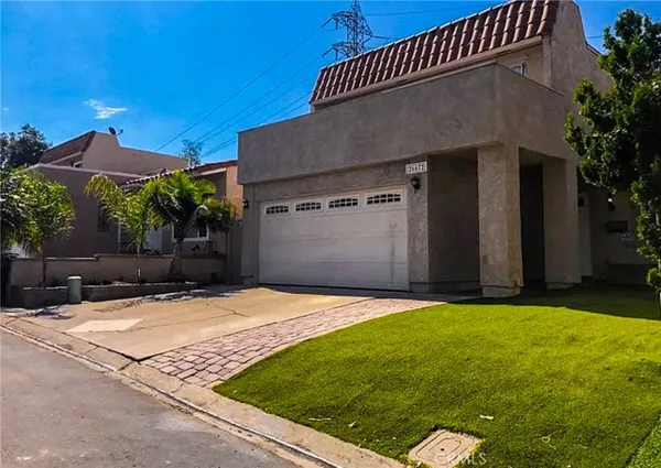 a front view of house with yard