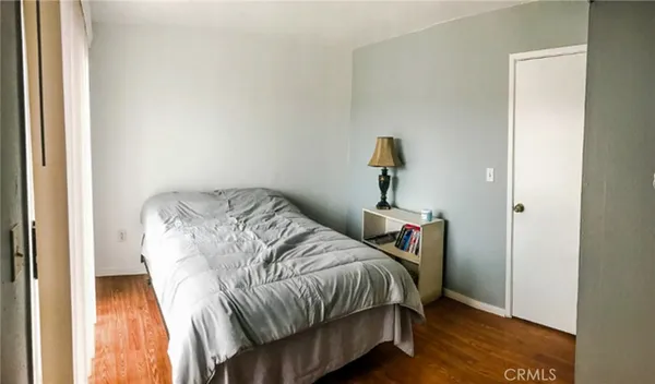 a bedroom with a bed and a closet