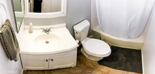 a bathroom with a toilet and a sink