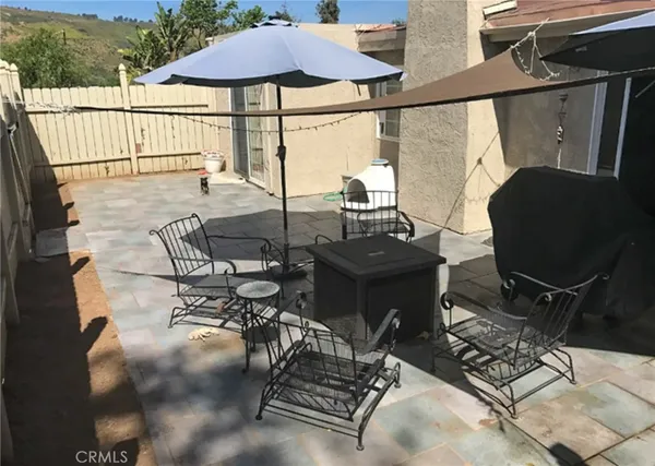 a view of an outdoor sitting area with furniture