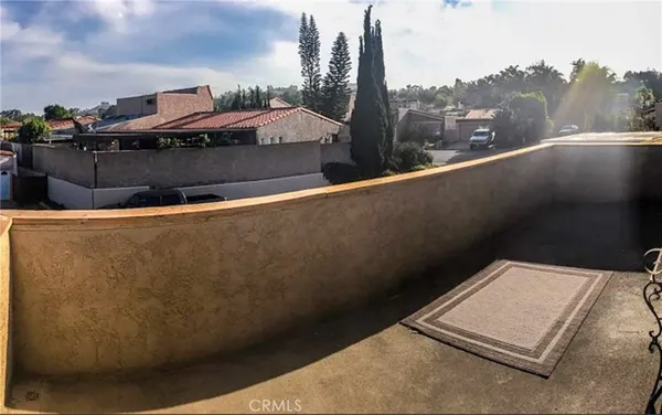a view of a backyard with swimming pool