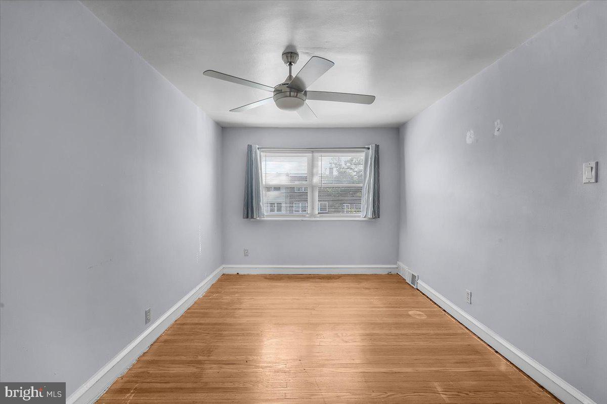 7823 Forrest Avenue Philadelphia, PA 19150 - Photo 12 of 27 a view of empty room with wooden floor