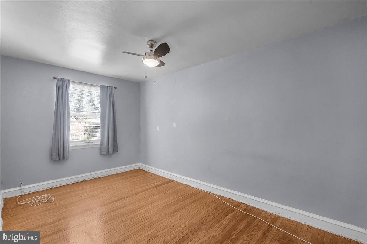 7823 Forrest Avenue Philadelphia, PA 19150 - Photo 14 of 27 a view of empty room with wooden floor and fan