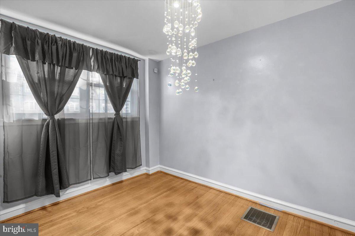 7823 Forrest Avenue Philadelphia, PA 19150 - Photo 10 of 27 a view of empty room with wooden floor