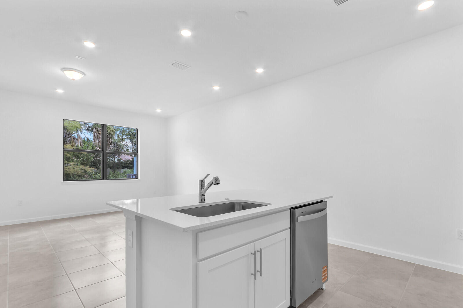 287 Southwest Sally Way Stuart, FL 34997 - Photo 11 of 41 a kitchen with a sink and a window