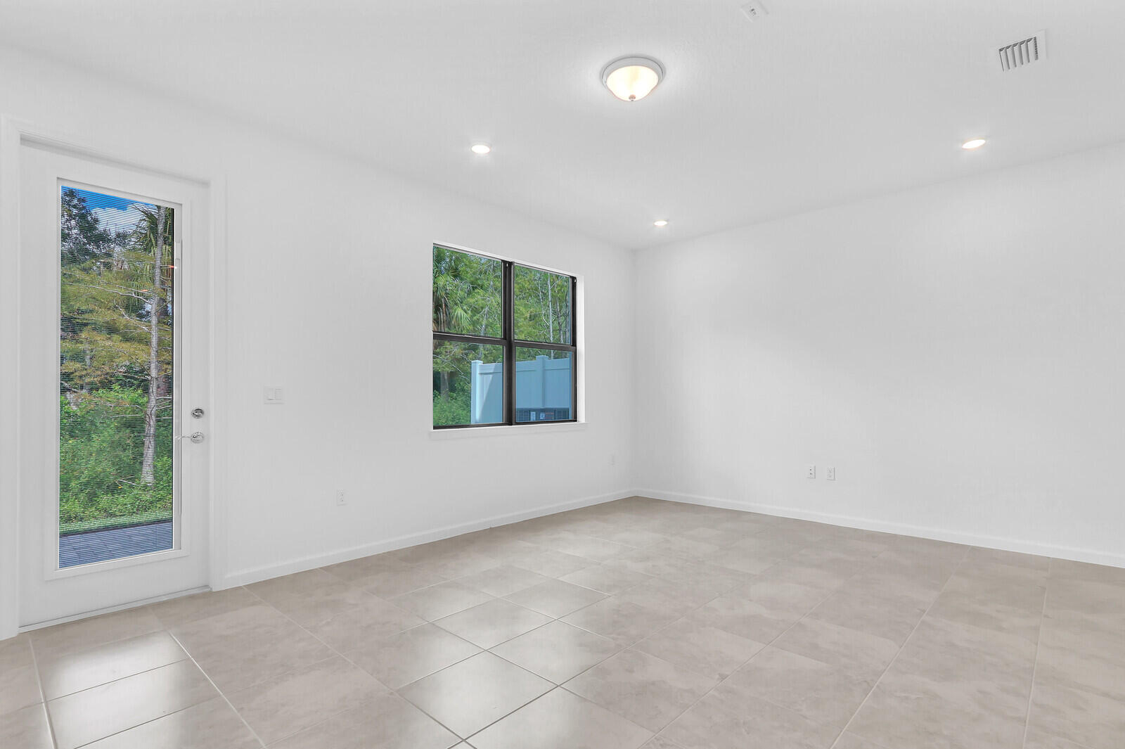 287 Southwest Sally Way Stuart, FL 34997 - Photo 16 of 41 an empty room with windows