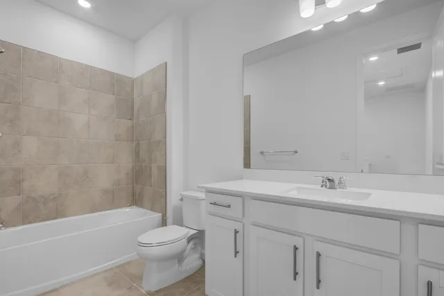 a bathroom with a sink a toilet and a bathtub