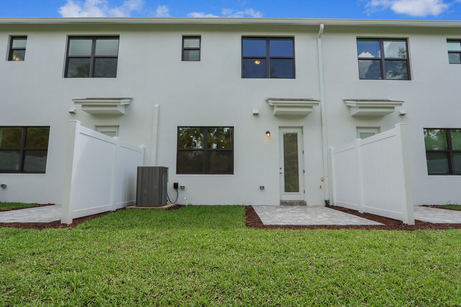 287 Southwest Sally Way Stuart, FL 34997 - Photo 30 of 41 a view of an front of house with a yard
