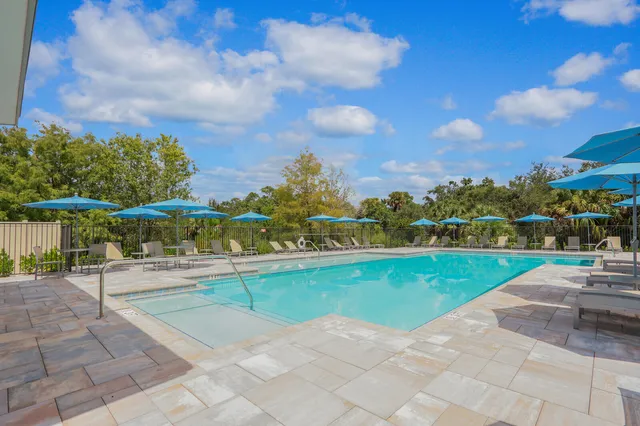 a view of a swimming pool and a yard
