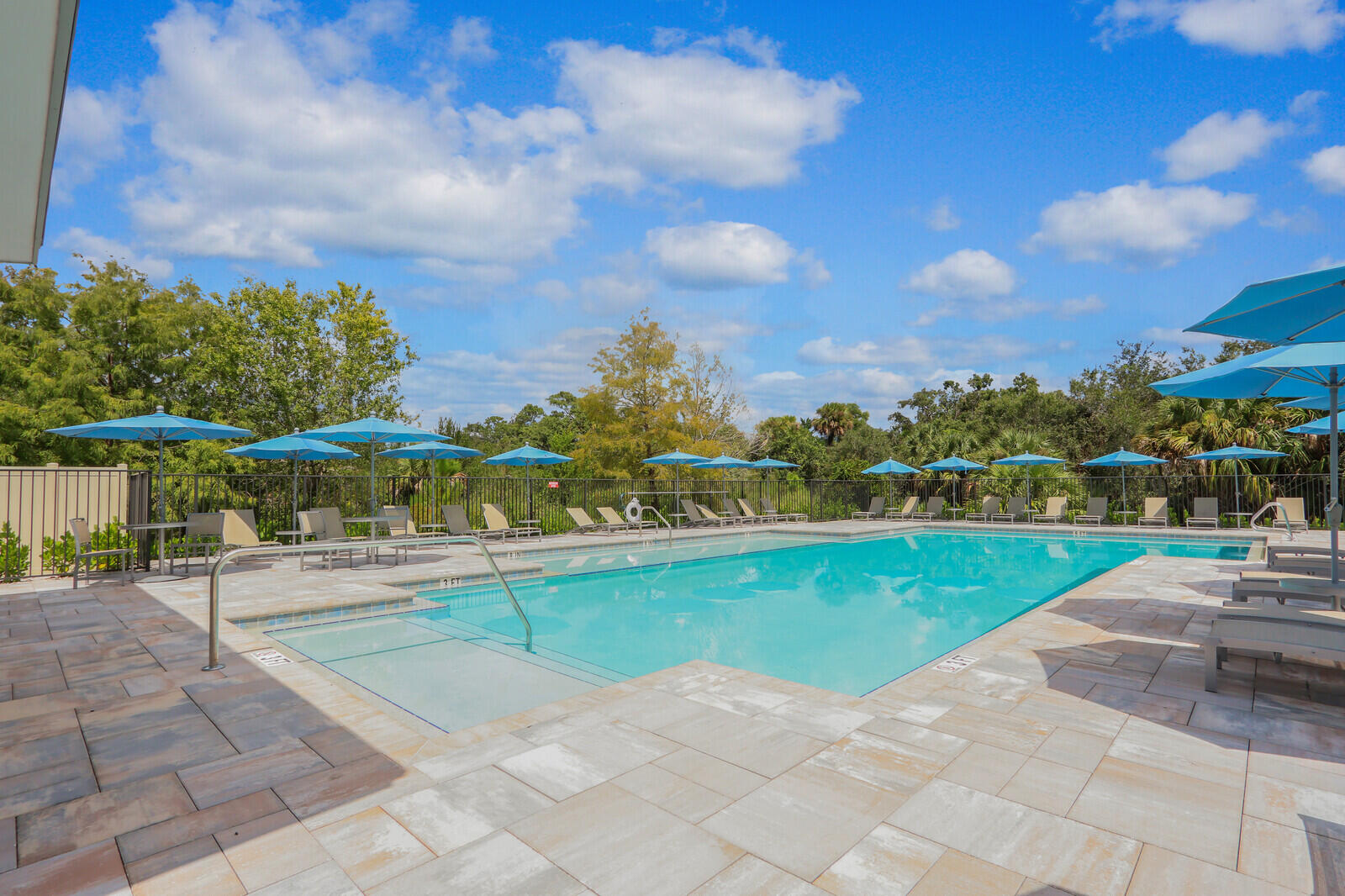 287 Southwest Sally Way Stuart, FL 34997 - Photo 31 of 41 a view of a swimming pool and a yard
