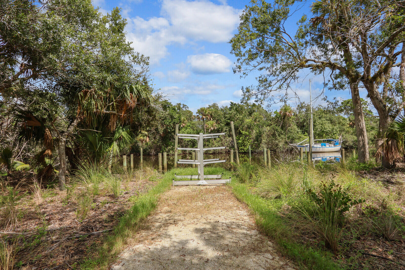 287 Southwest Sally Way Stuart, FL 34997 - Photo 35 of 41 a view of a garden with large trees