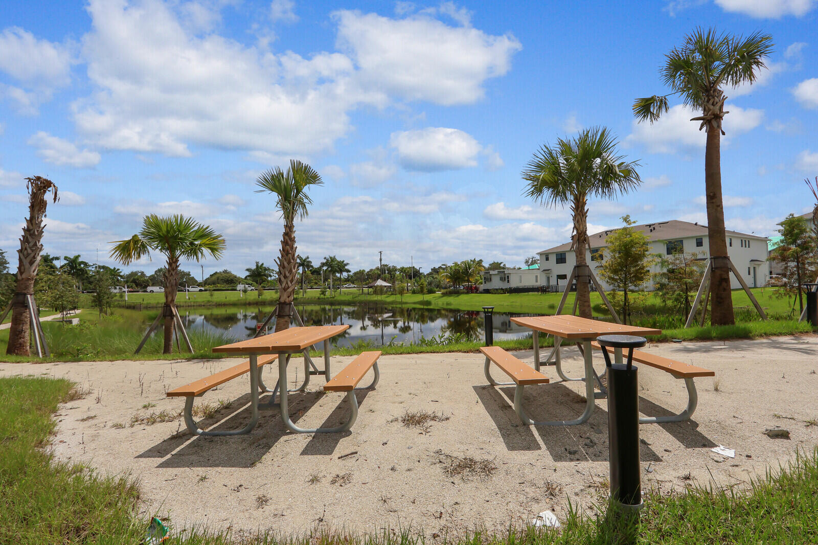 287 Southwest Sally Way Stuart, FL 34997 - Photo 38 of 41 a view of a lake with a table and chairs