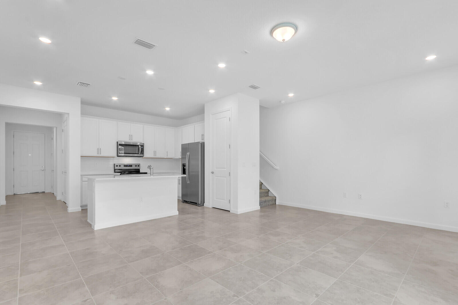 287 Southwest Sally Way Stuart, FL 34997 - Photo 7 of 41 a view of kitchen with stainless steel appliances refrigerator oven