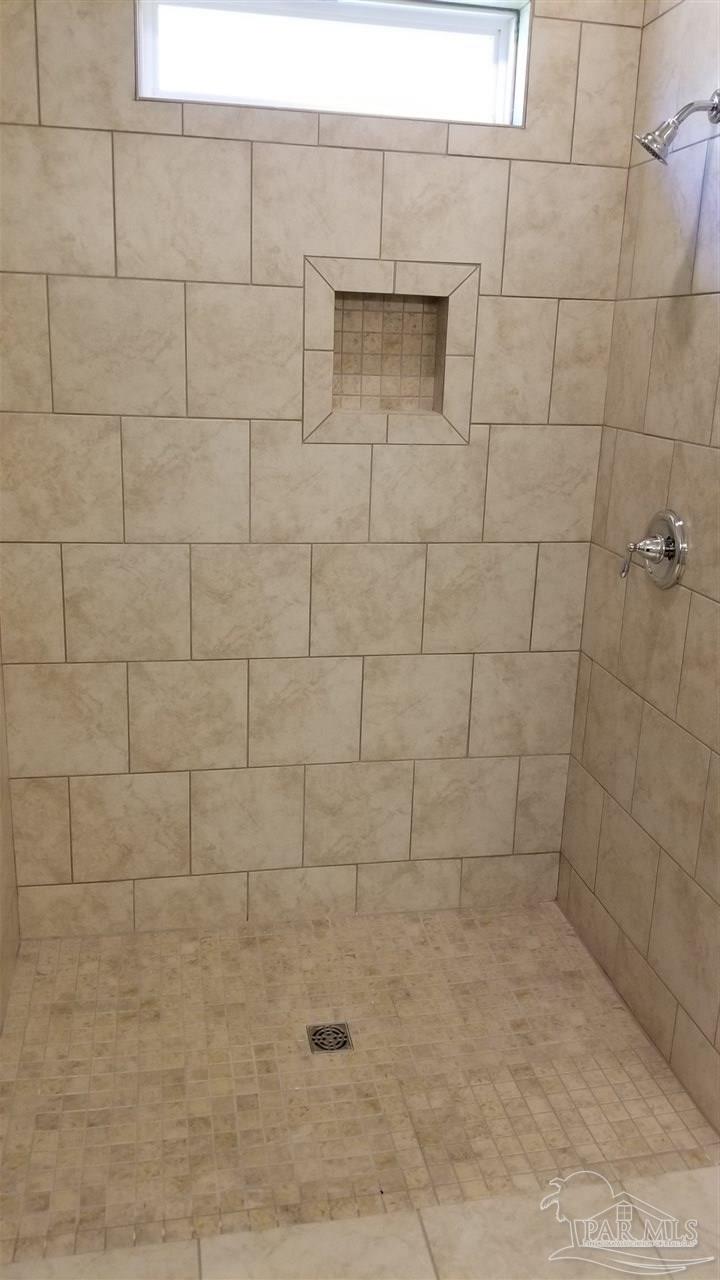 7787 Burnside Loop Pensacola, FL 32526 - Photo 14 of 32 a bathroom with a shower