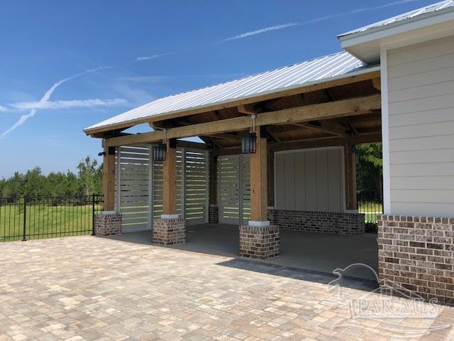 7787 Burnside Loop Pensacola, FL 32526 - Photo 20 of 32 a front view of a house with a backyard