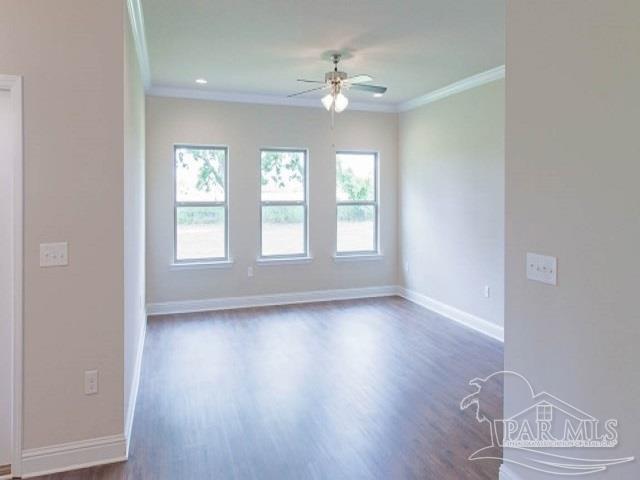 7787 Burnside Loop Pensacola, FL 32526 - Photo 9 of 32 an empty room with wooden floor chandelier fan and windows