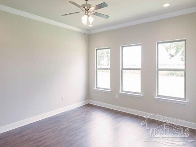 7787 Burnside Loop Pensacola, FL 32526 - Photo 10 of 32 an empty room with wooden floor windows and fan