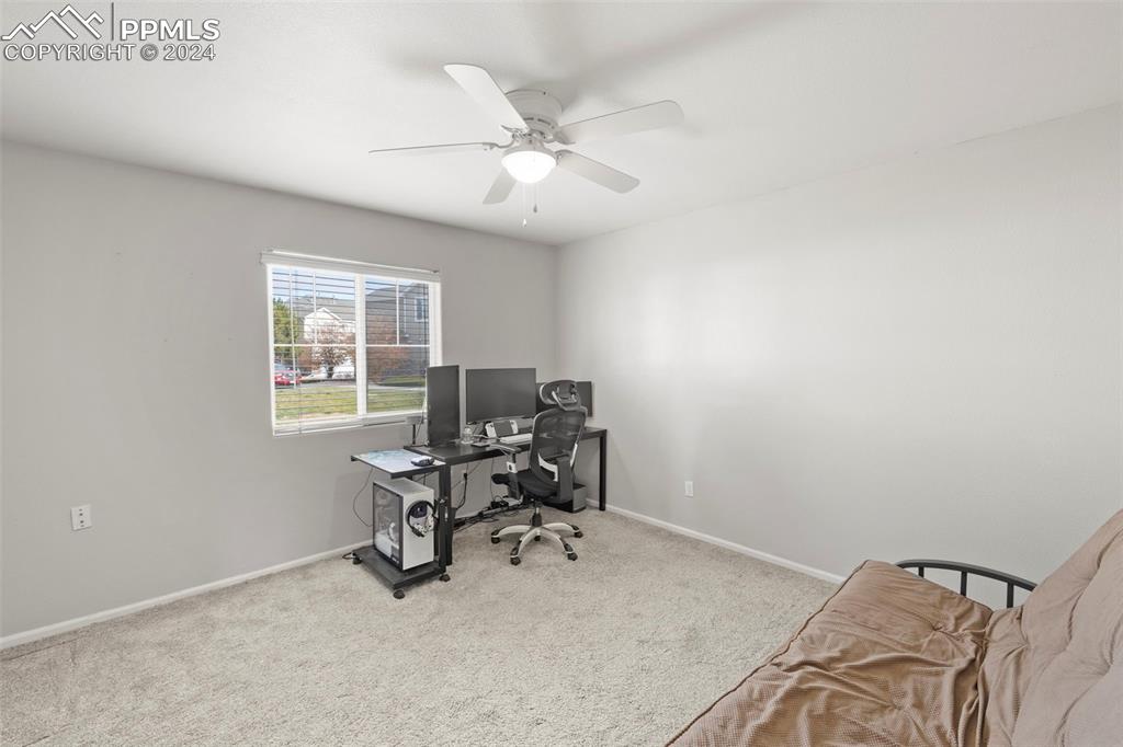 7861 Sandy Springs Point Fountain, CO 80817 - Photo 14 of 18 Bedroom #2 featuring ceiling fan and light carpet