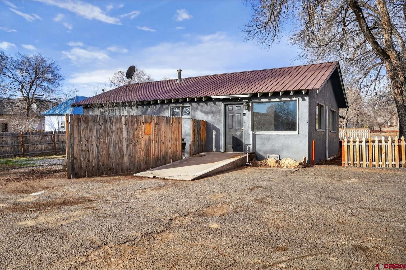 501 East 2nd Street Cortez, CO 81321 - Photo 1 of 30 a backyard of a house