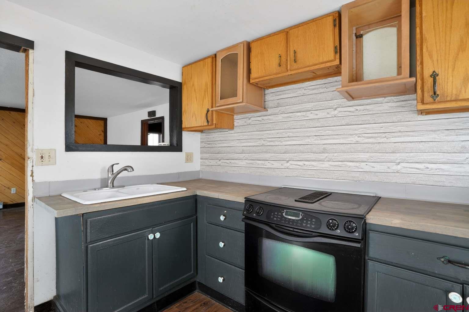 501 East 2nd Street Cortez, CO 81321 - Photo 17 of 30 a kitchen with a stove and a sink