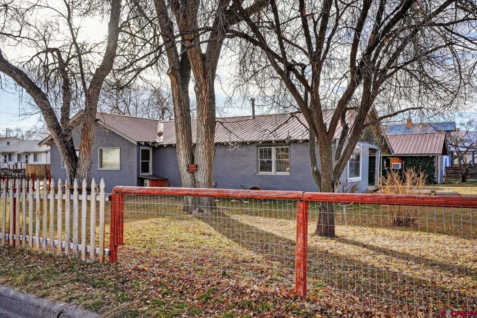 501 East 2nd Street Cortez, CO 81321 - Photo 2 of 30 a front view of a house with a yard