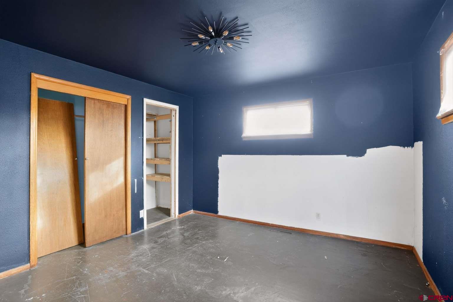 501 East 2nd Street Cortez, CO 81321 - Photo 22 of 30 a view of a livingroom with a ceiling fan and window