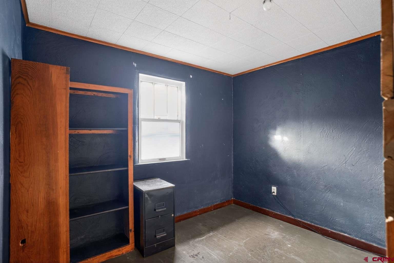501 East 2nd Street Cortez, CO 81321 - Photo 23 of 30 a view of an empty room with a window