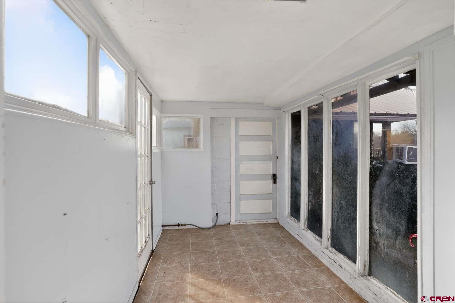 501 East 2nd Street Cortez, CO 81321 - Photo 27 of 30 an empty room with window and closet