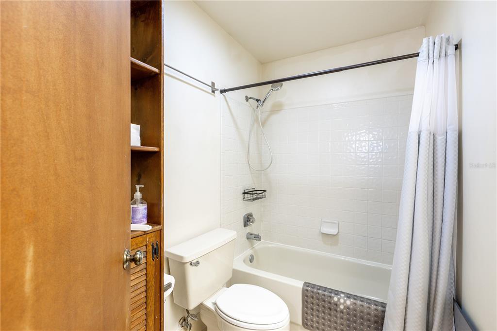 5208 Southwest 86 Terrace Gainesville, FL 32608 - Photo 19 of 26 a bathroom with a shower and a toilet