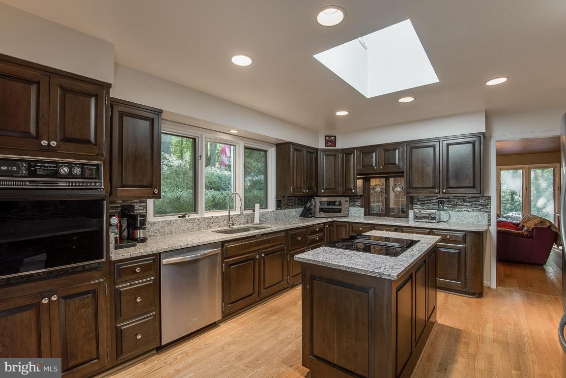 Solid wood cabinets with etched glass & pantry