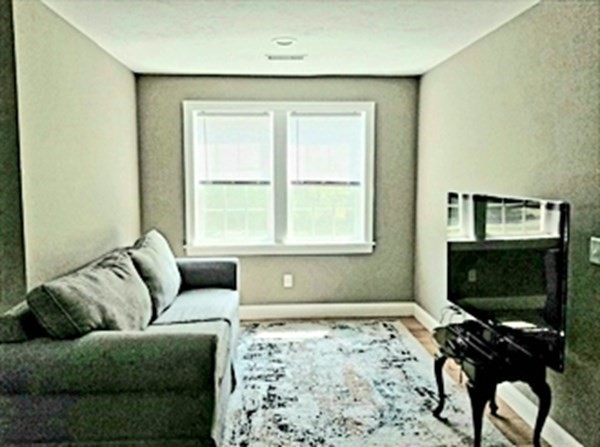 7 Dean Farm Road Sutton, MA 01590 - Photo 14 of 33 a living room with furniture and a flat screen tv