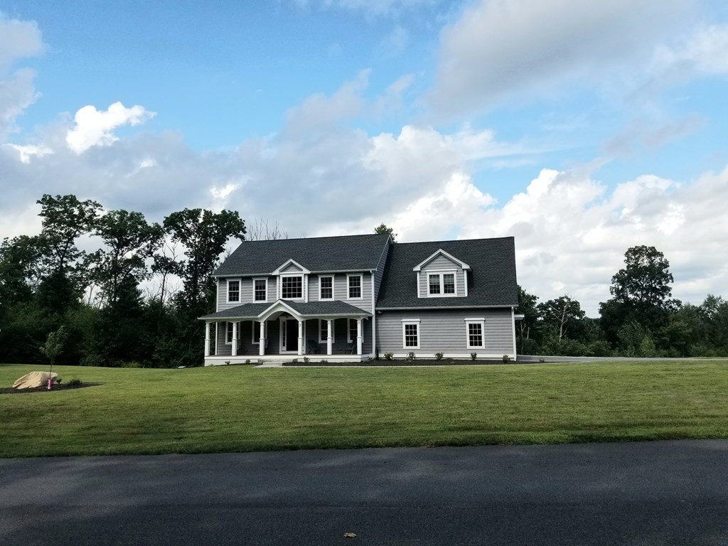 7 Dean Farm Road Sutton, MA 01590 - Photo 2 of 33 a front view of a house with a yard