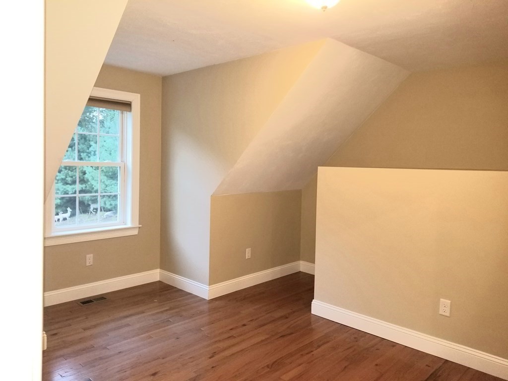 7 Dean Farm Road Sutton, MA 01590 - Photo 27 of 33 an empty room with wooden floor and windows
