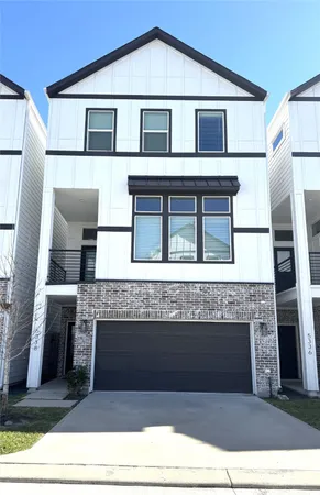 a front view of a house with a garage