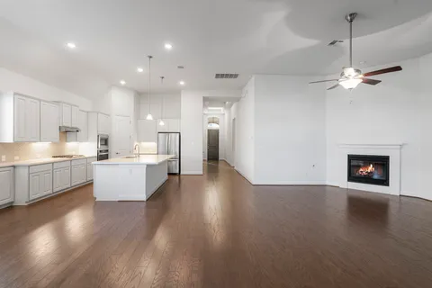 a view of a kitchen with a sink and a stove top oven