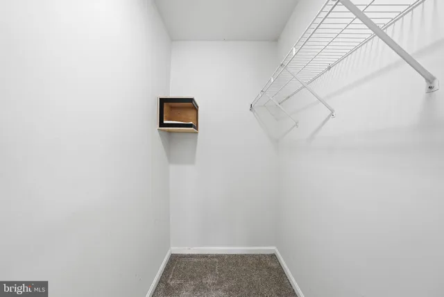 a view of small space with empty racks on the wall