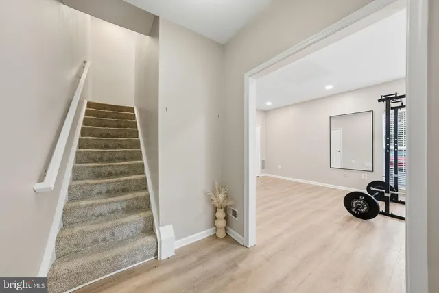 a view of an entryway with wooden floor