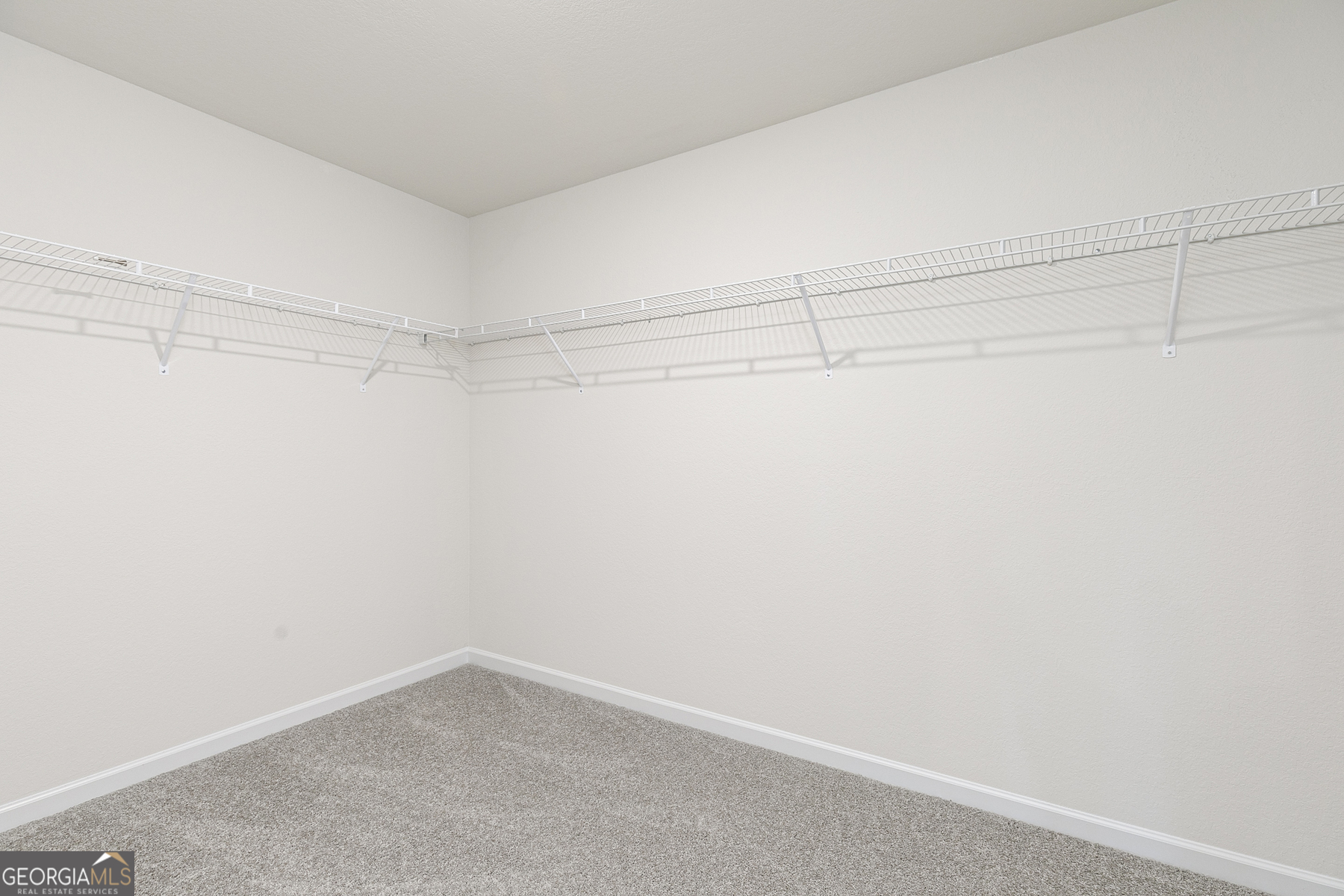621 Slate Road Conyers, GA 30013 - Photo 16 of 21 a view of a room with racks on the wall
