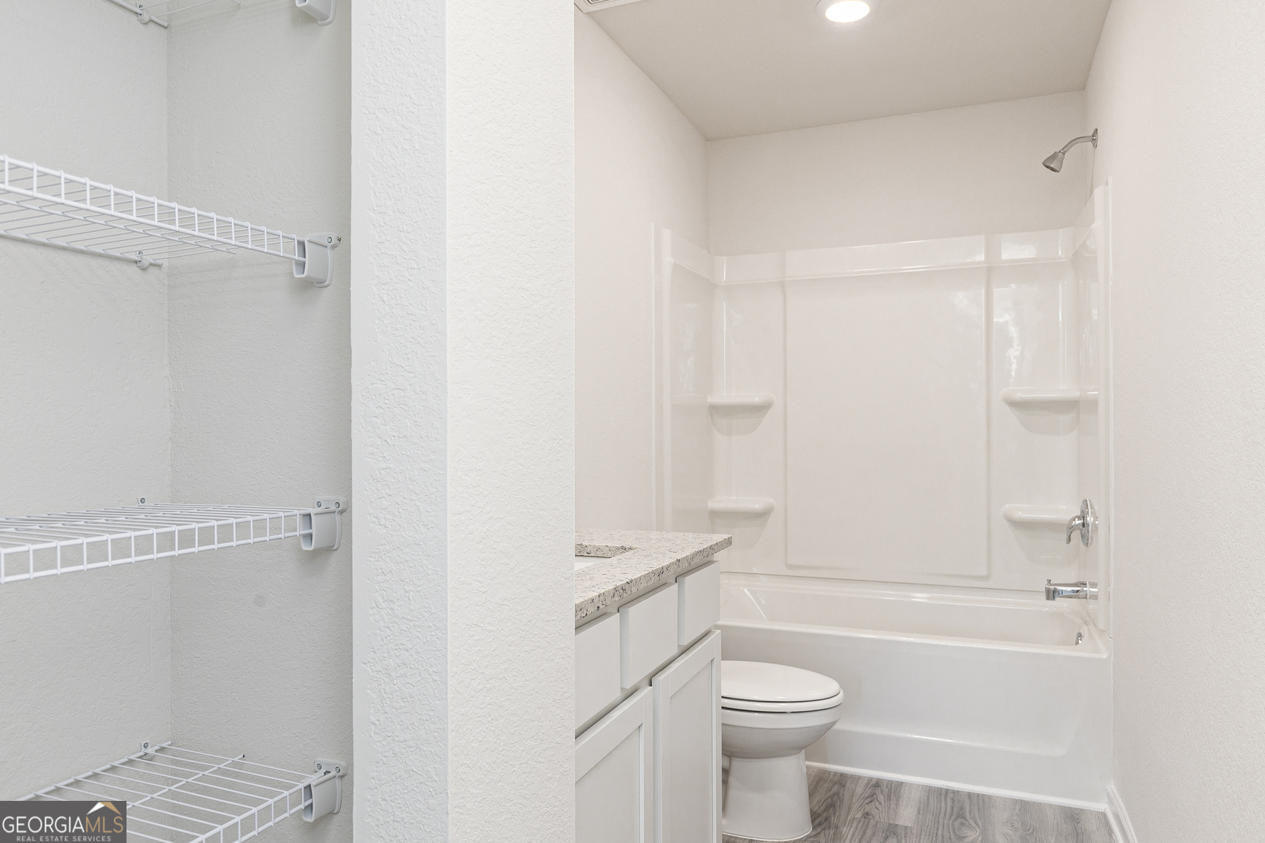 621 Slate Road Conyers, GA 30013 - Photo 17 of 21 a bathroom with a toilet a sink and a bathtub
