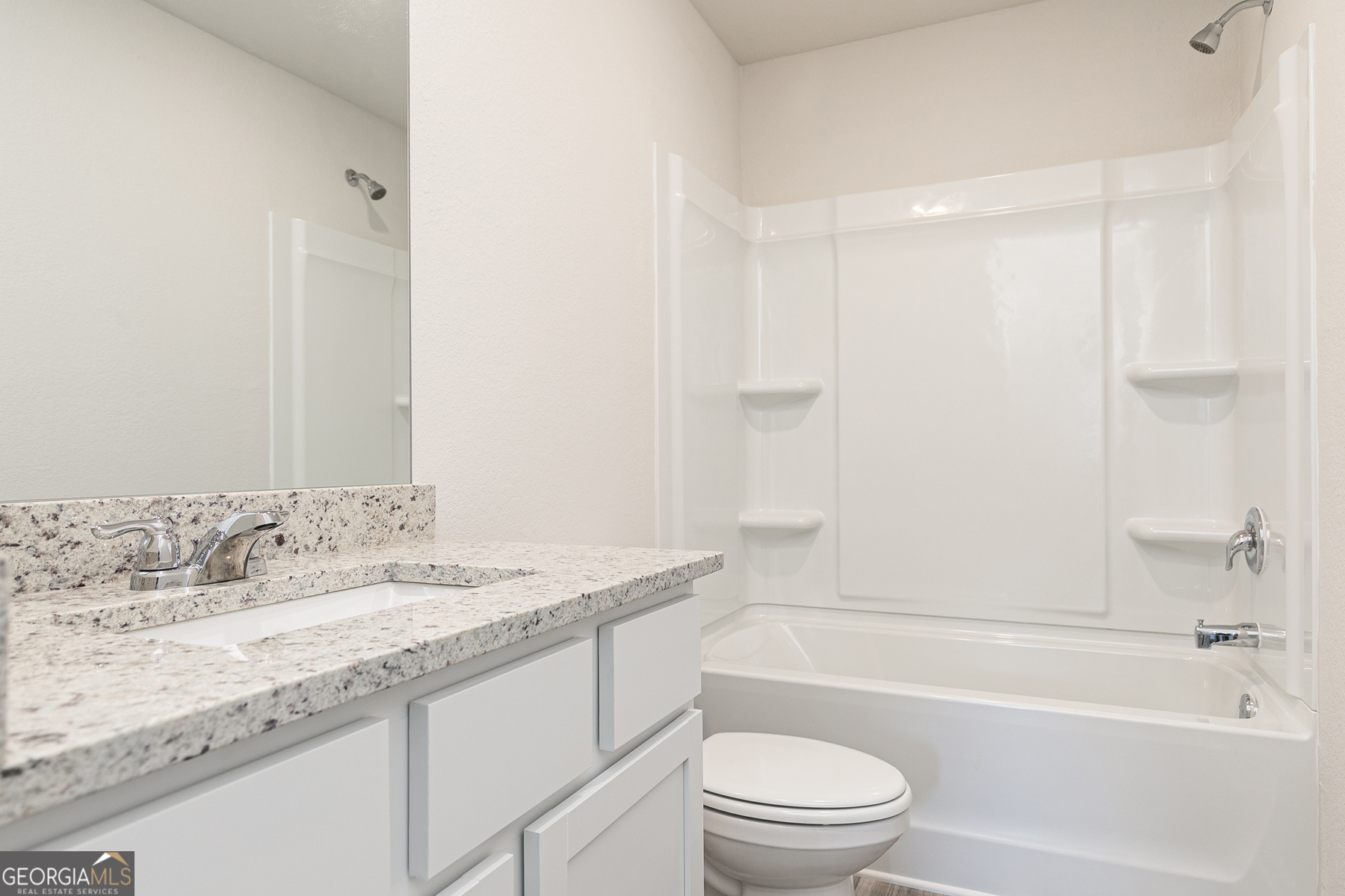 621 Slate Road Conyers, GA 30013 - Photo 18 of 21 a bathroom with a granite countertop sink a toilet and bathtub