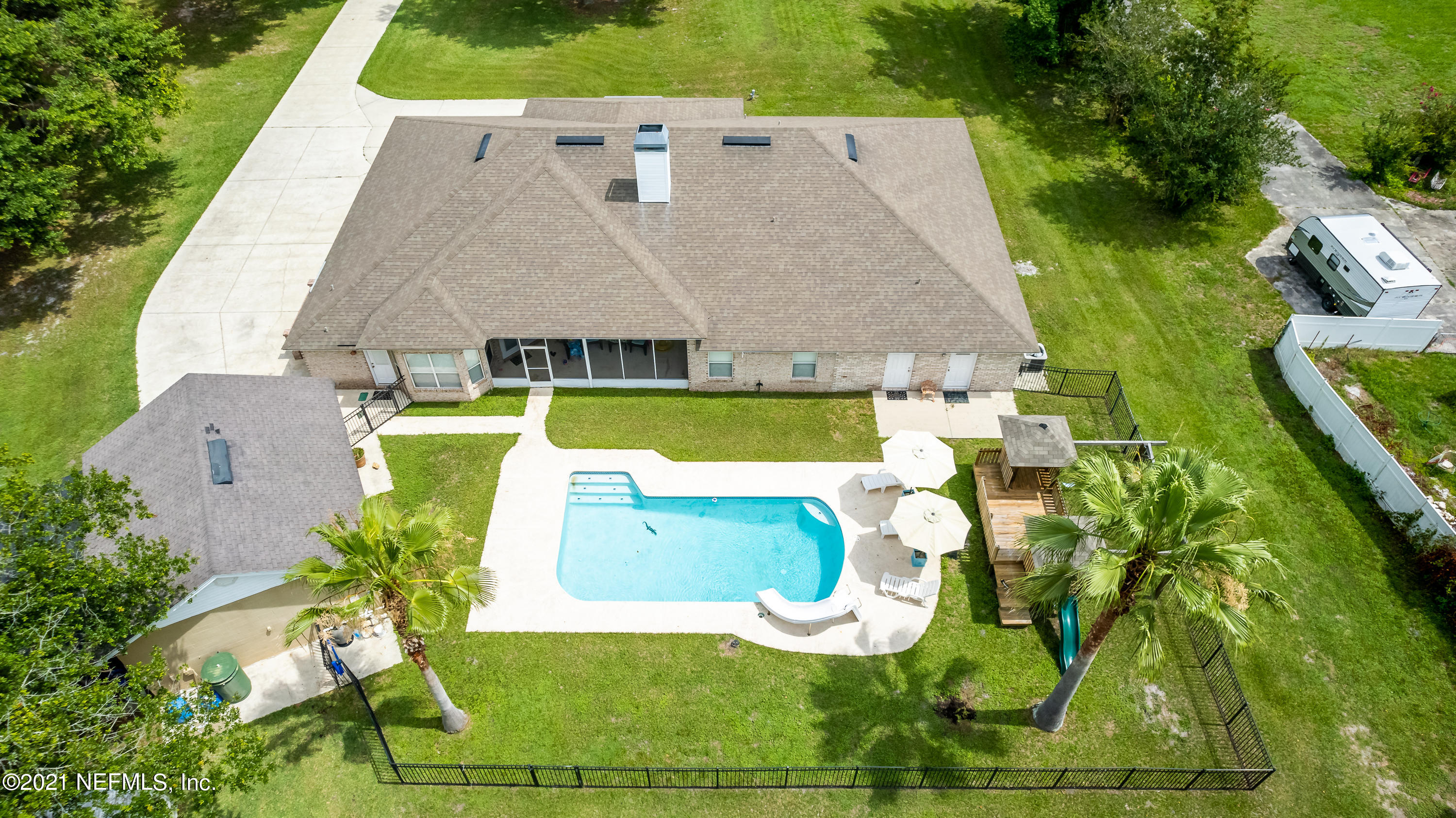 1123 Cactus Cut Road Middleburg, FL 32068 - Photo 1 of 66 an aerial view of a house with a swimming pool