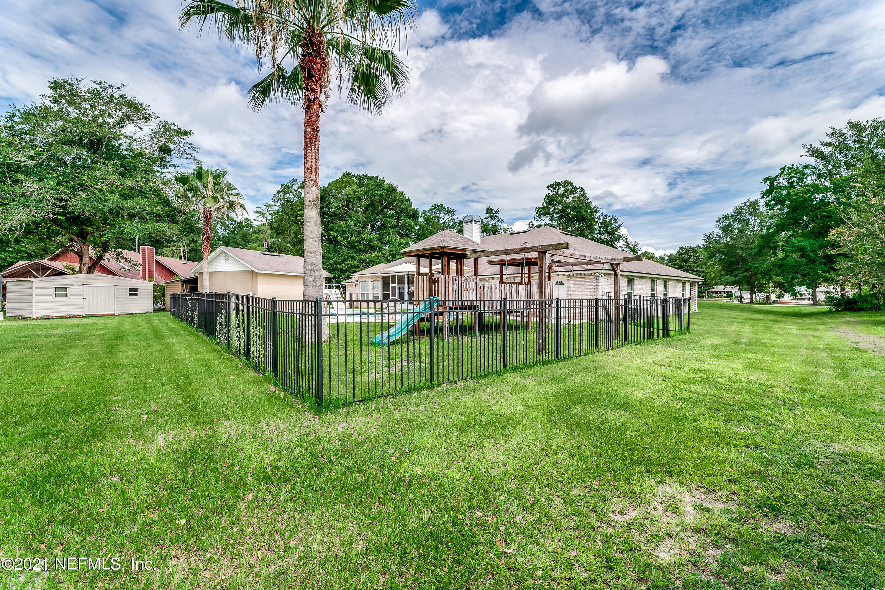 1123 Cactus Cut Road Middleburg, FL 32068 - Photo 12 of 66 a view of a house with backyard and a sitting area