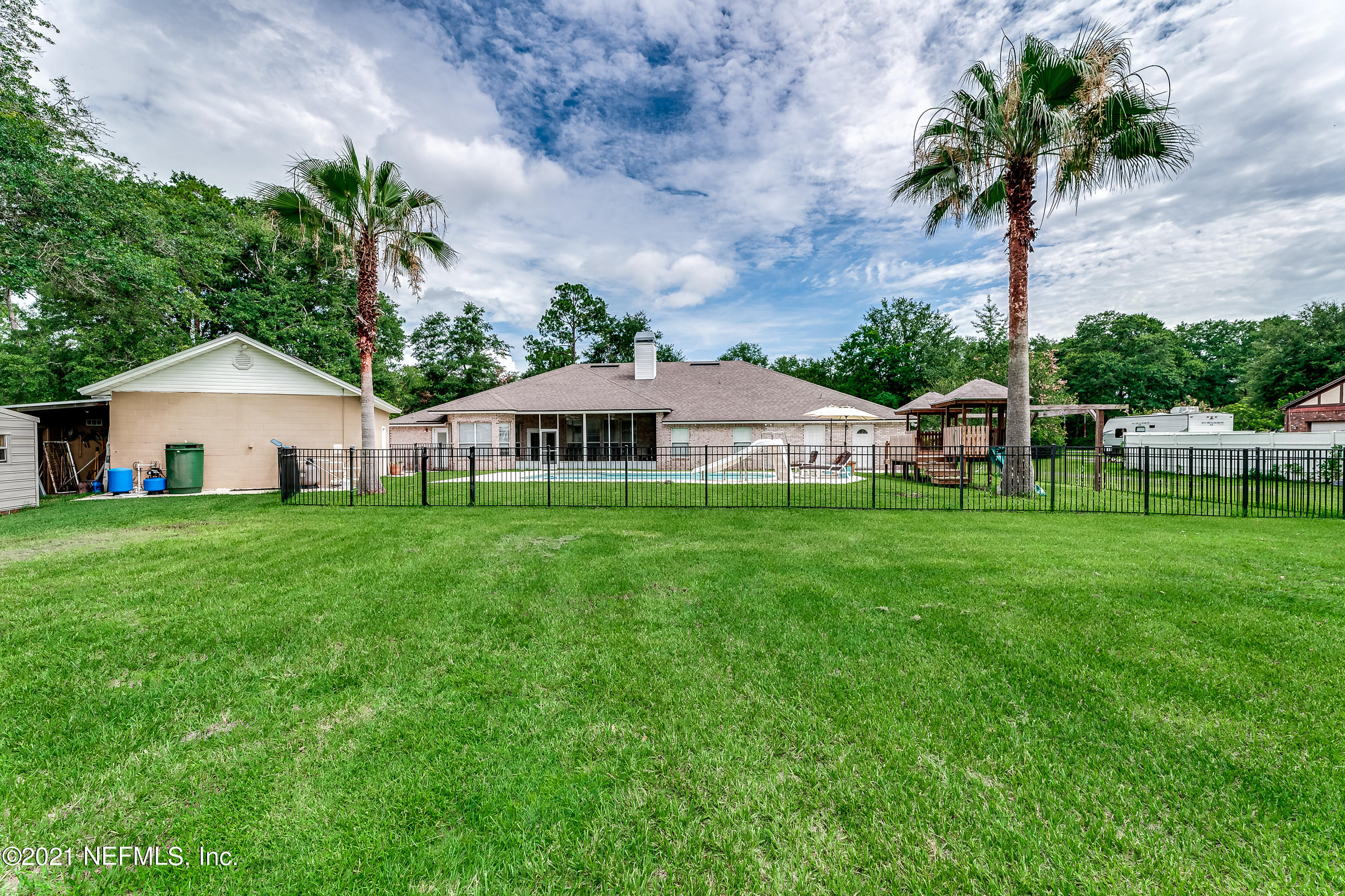 1123 Cactus Cut Road Middleburg, FL 32068 - Photo 13 of 66 a front view of house with a yard and potted plants