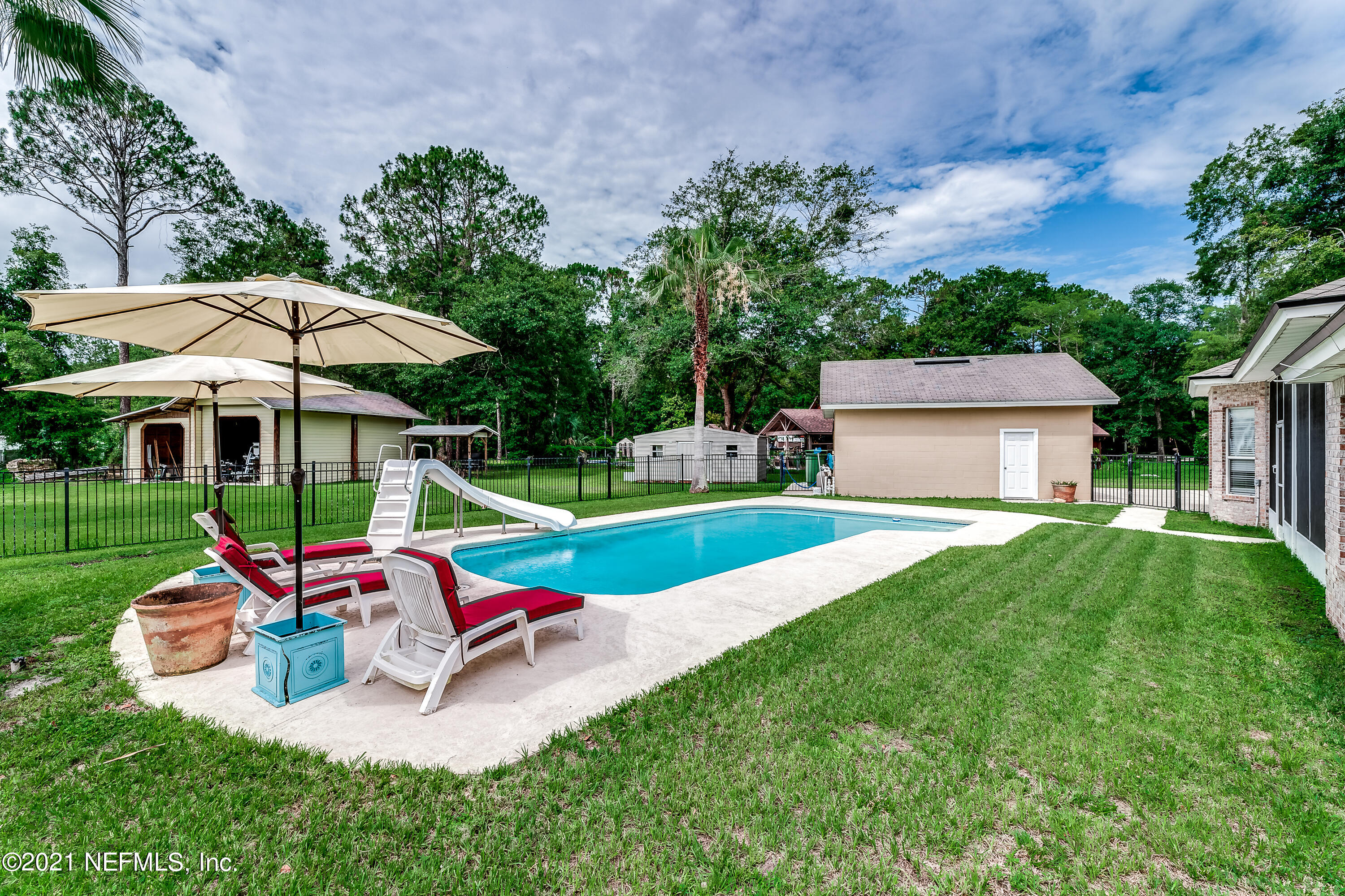1123 Cactus Cut Road Middleburg, FL 32068 - Photo 18 of 66 a view of a house with a yard porch and sitting area