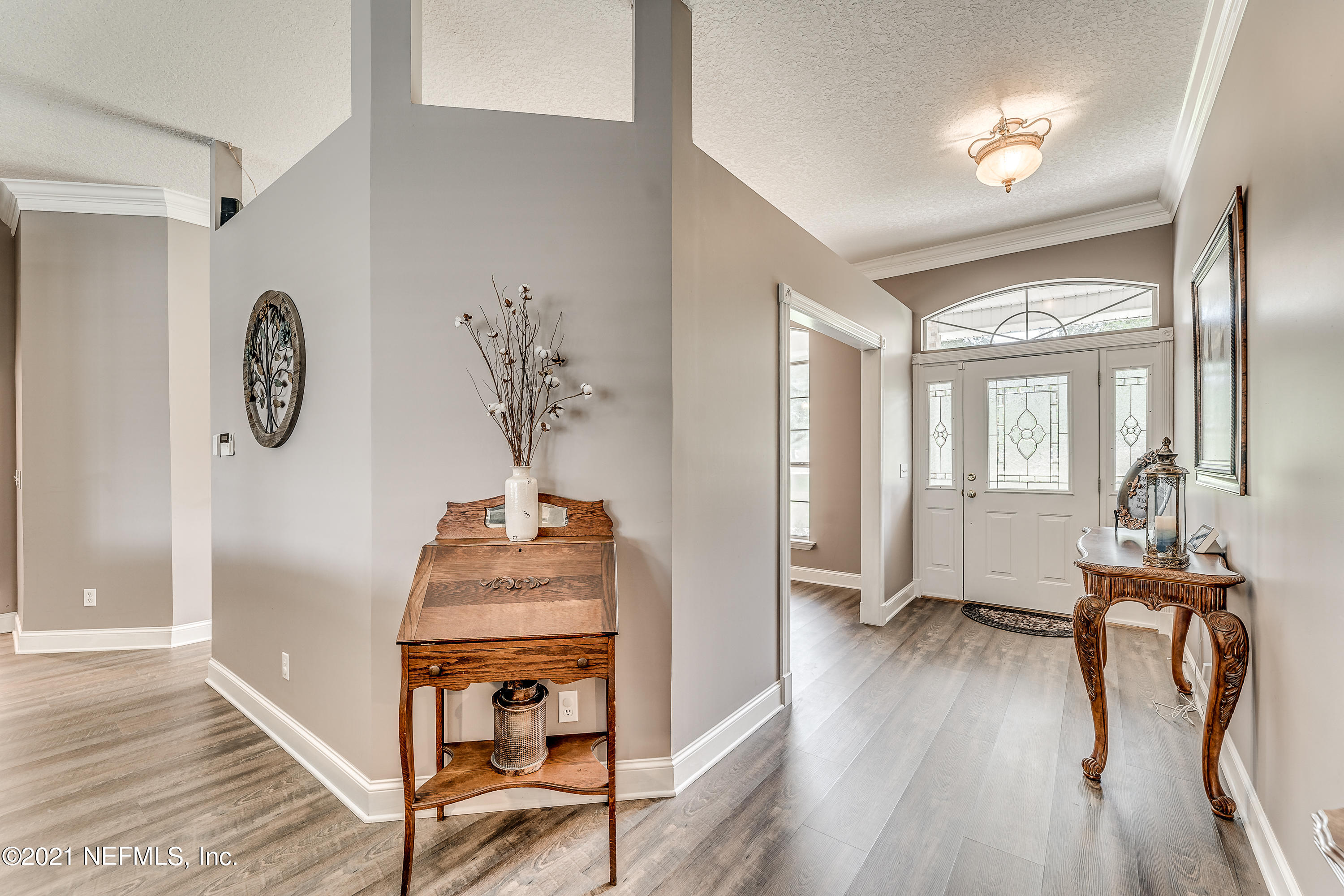 1123 Cactus Cut Road Middleburg, FL 32068 - Photo 22 of 66 a view of a hallway with wooden floor and workspace