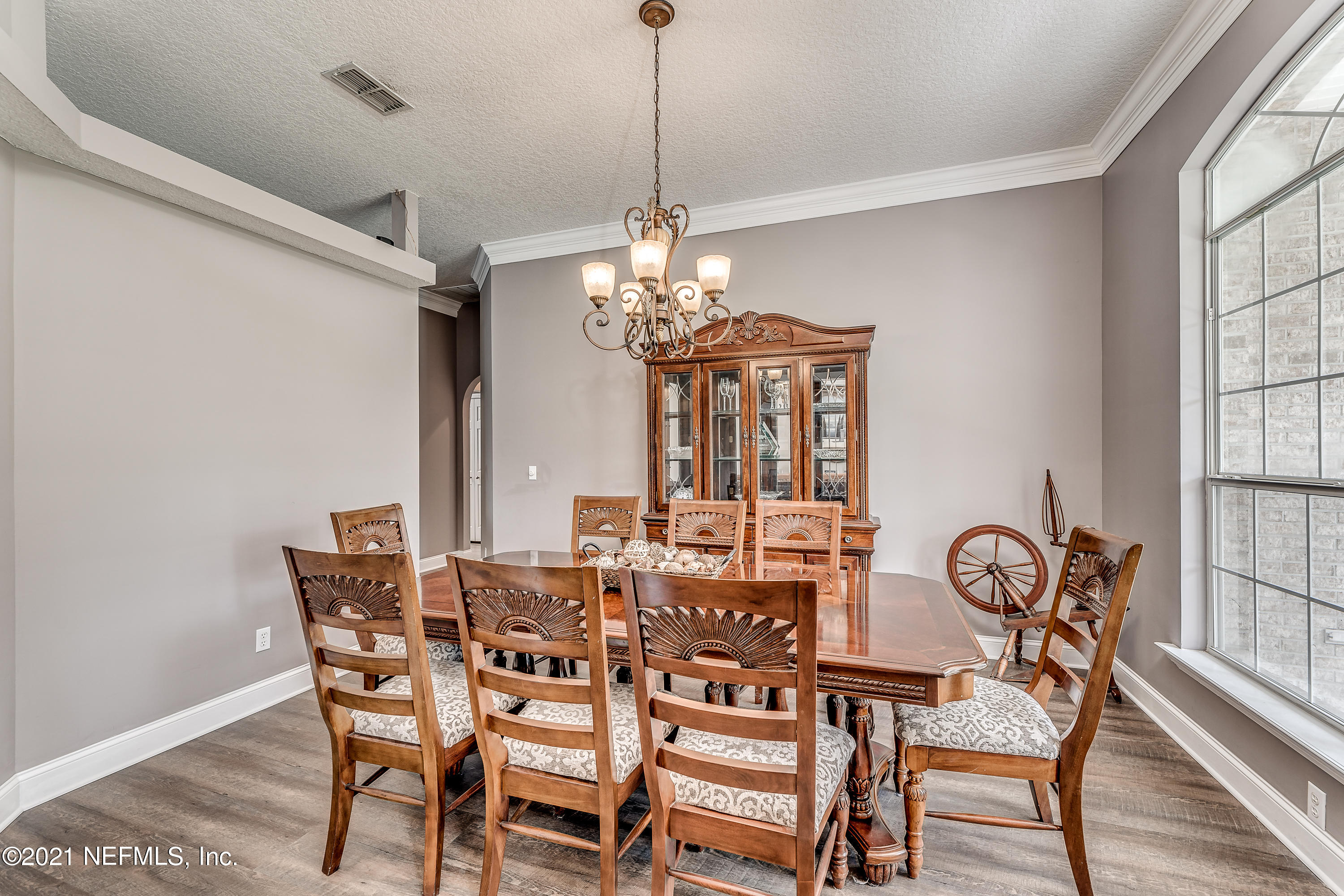 1123 Cactus Cut Road Middleburg, FL 32068 - Photo 23 of 66 a view of a dining room with furniture window and wooden floor