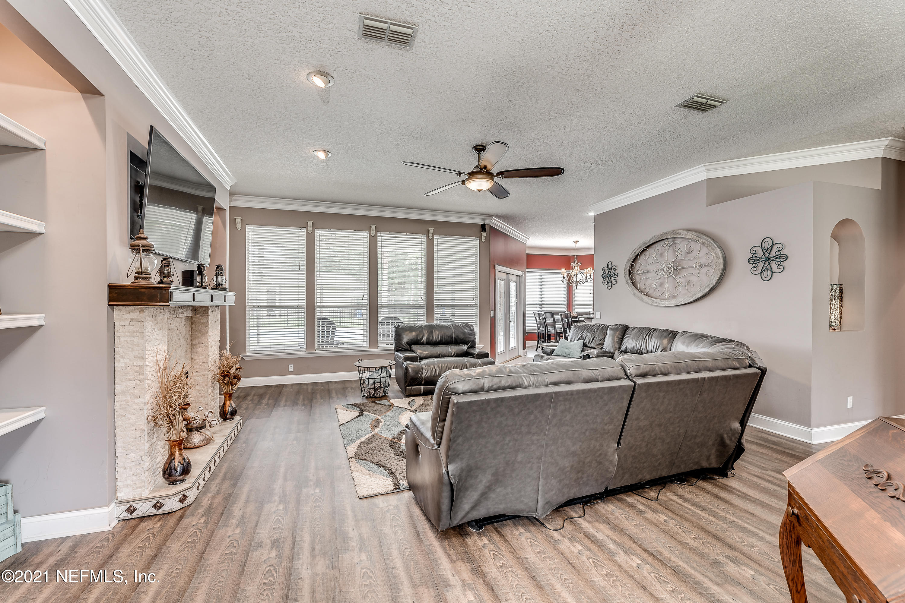1123 Cactus Cut Road Middleburg, FL 32068 - Photo 25 of 66 a living room with furniture and a large window