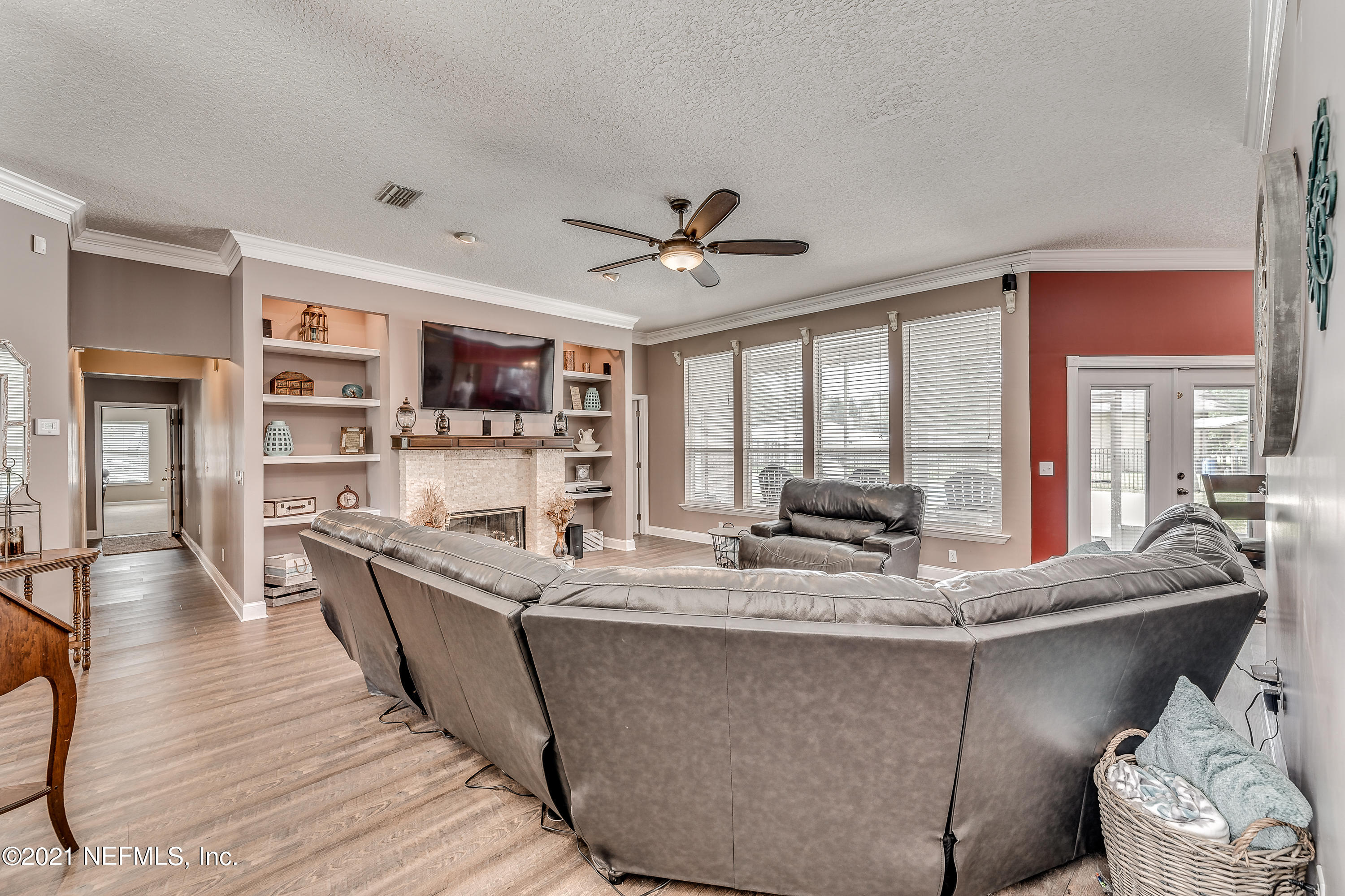 1123 Cactus Cut Road Middleburg, FL 32068 - Photo 26 of 66 a living room with stainless steel appliances granite countertop furniture a fireplace and a large window