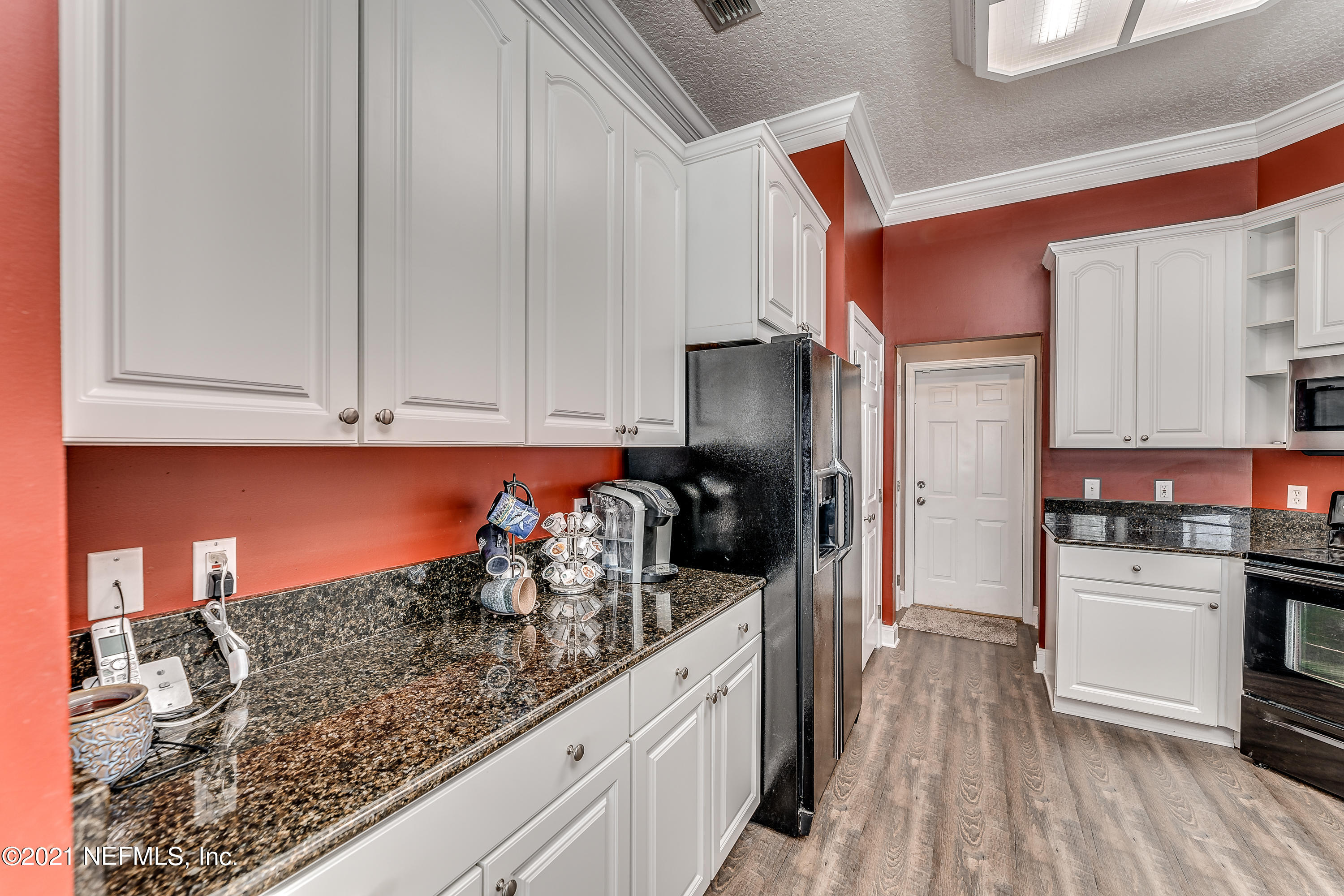1123 Cactus Cut Road Middleburg, FL 32068 - Photo 35 of 66 a kitchen with stainless steel appliances granite countertop a stove and a sink